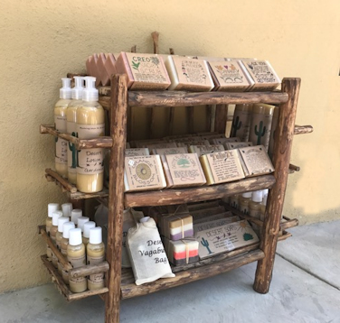 Rustic shelving designed to show off the Desert Soaps line of soaps.